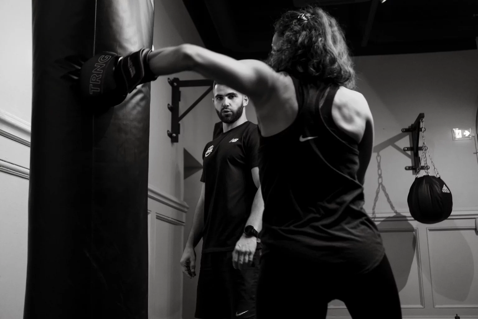 Adherent atteignant son objectif avec un coach sportif au Hook a Lille